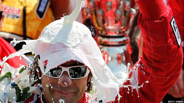 Dario Franchitti of Scotland celebrates winning a race in Indianapolis
