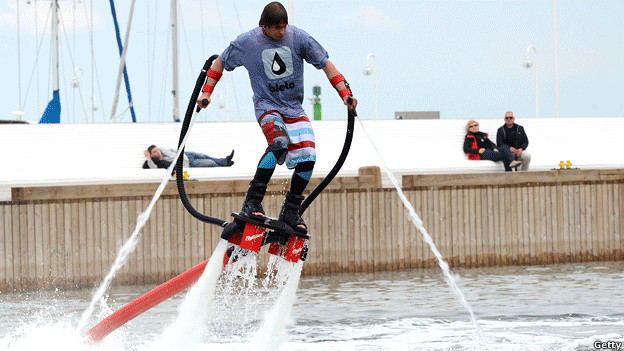 A man with hydro shoes flies over water in the Baltic Sea