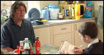 A man practising questions with a boy
