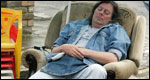 A man asleep in a chair
