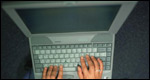 A person typing on a computer